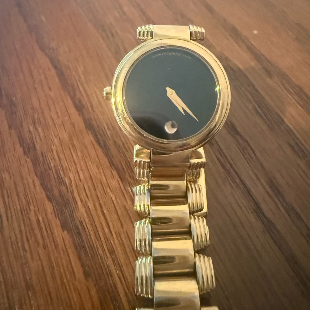 Movado Gold Watch with Black Face